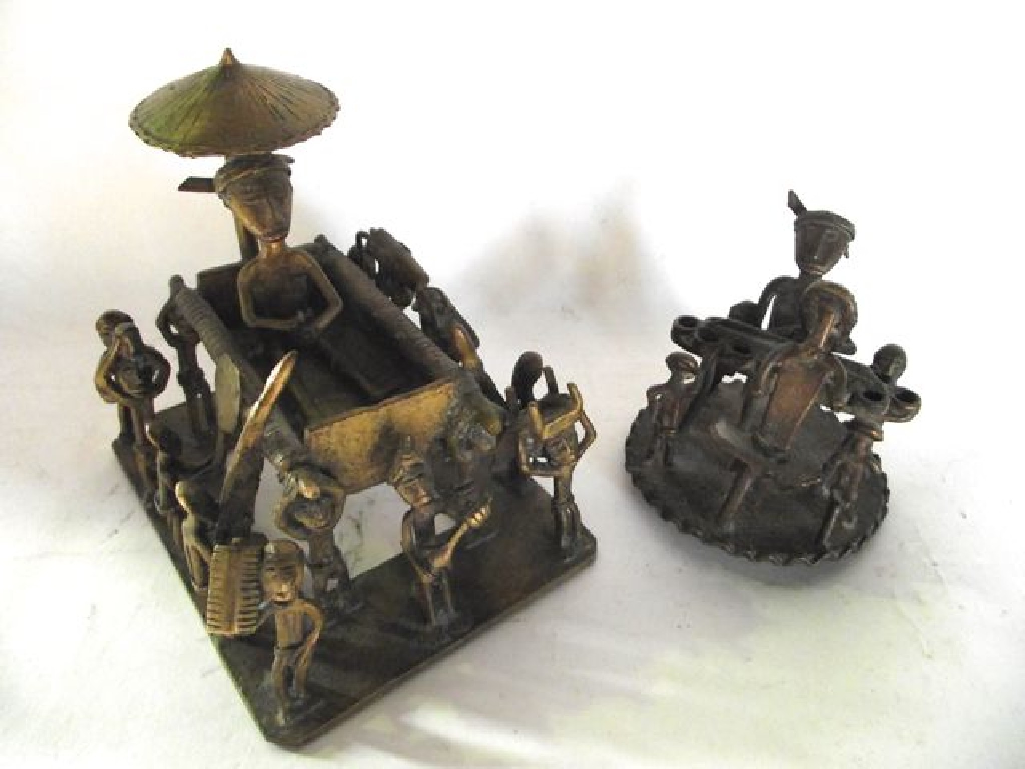 Appraisal: An African metalwork sculptural group depicting a parade of figures