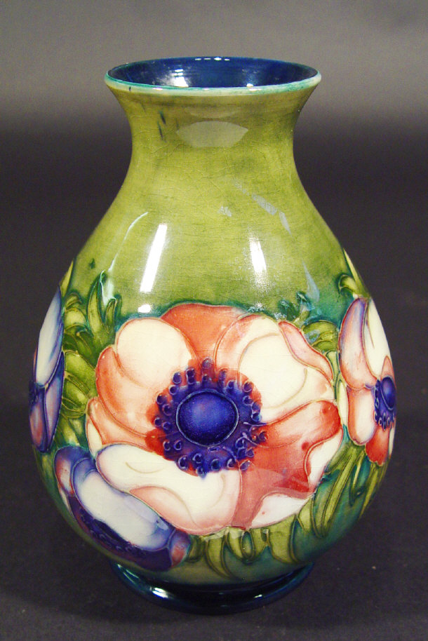 Appraisal: Moorcroft vase hand painted and tubelined with anenomes onto a