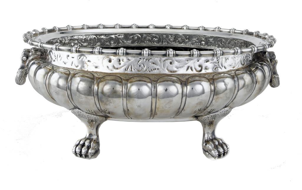 Appraisal: A GEORGE V WINE CISTERN of lobed oval form the