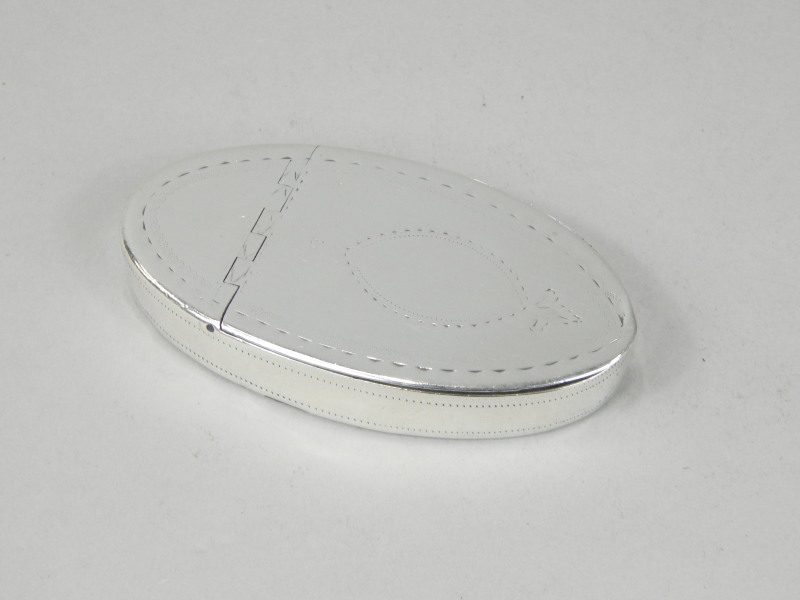 Appraisal: An oval thC Irish silver snuff box with engraved decoration