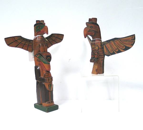 Appraisal: Two Kwakiutl totem poles The smaller example by Charlie James