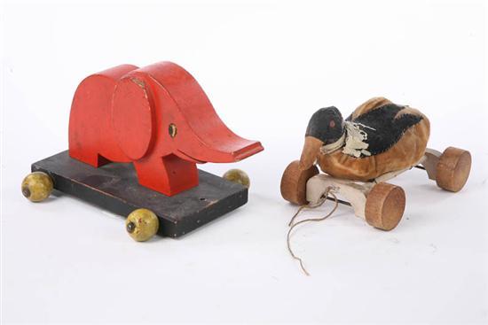 Appraisal: TWO PULL TOYS An orange painted wooden elephant on a