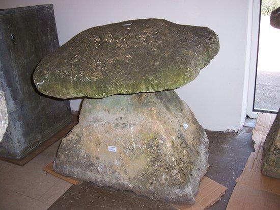 Appraisal: A large staddle stone on a squat base cm high