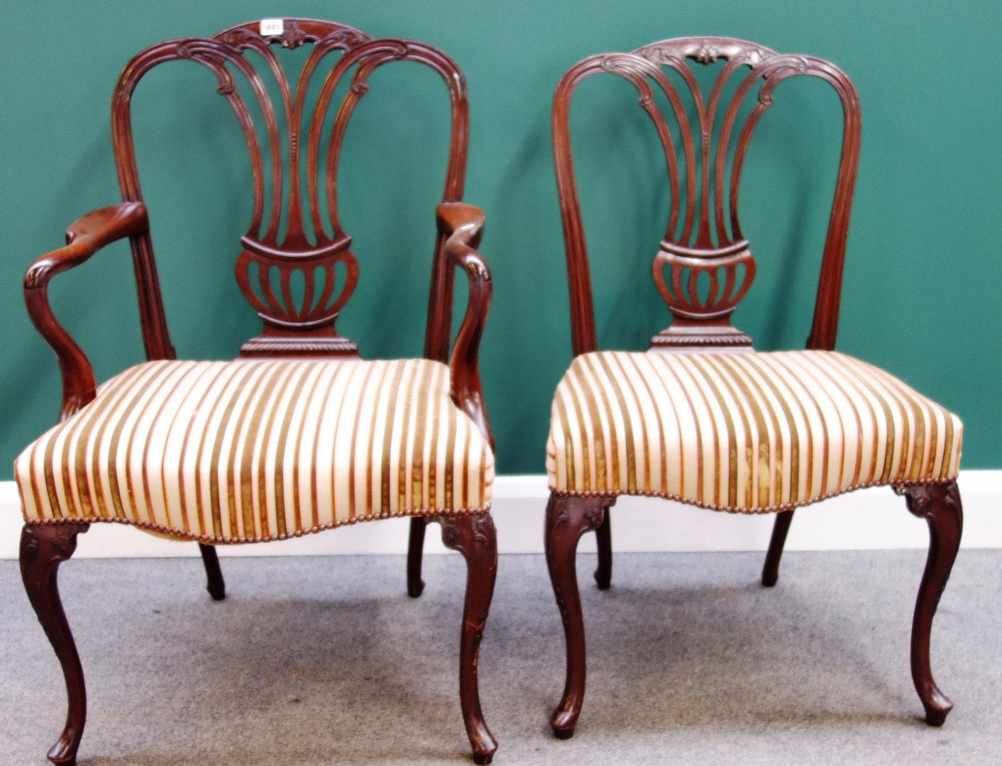 Appraisal: A matched set of twelve mahogany framed dining chairs with