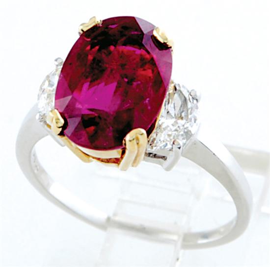 Appraisal: Ruby and diamond ring oval ruby ct and two half-moon-cut