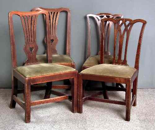 Appraisal: A pair of th Century mahogany dining chairs with fretted