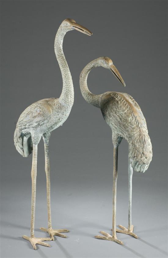 Appraisal: Two bronze crane sculptures Crane facing backwards h Crane facing