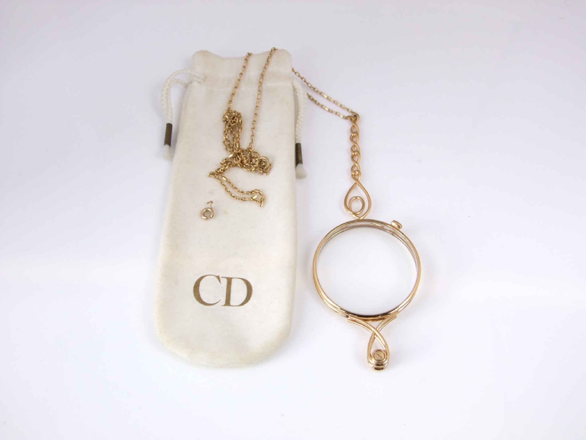 Appraisal: A gilt metal folding lorgnette Christian Dior attached with a