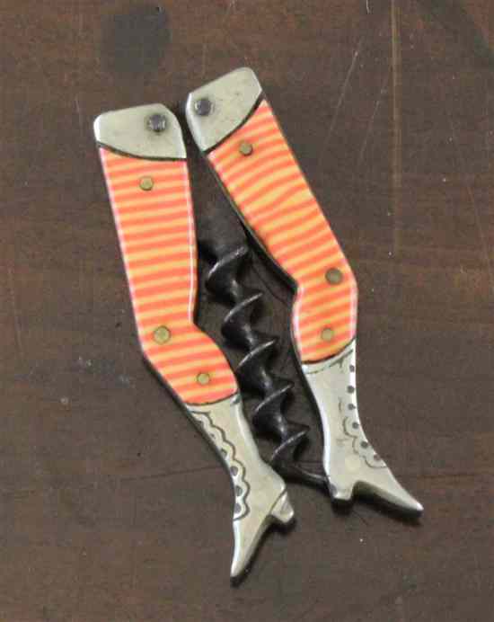 Appraisal: A German novelty lady's legs corkscrew with striped stockings in