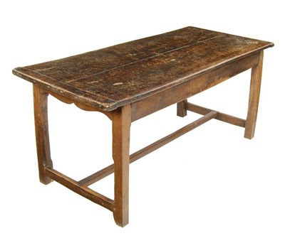 Appraisal: A French fruitwood and oak farmhouse table the cleated end