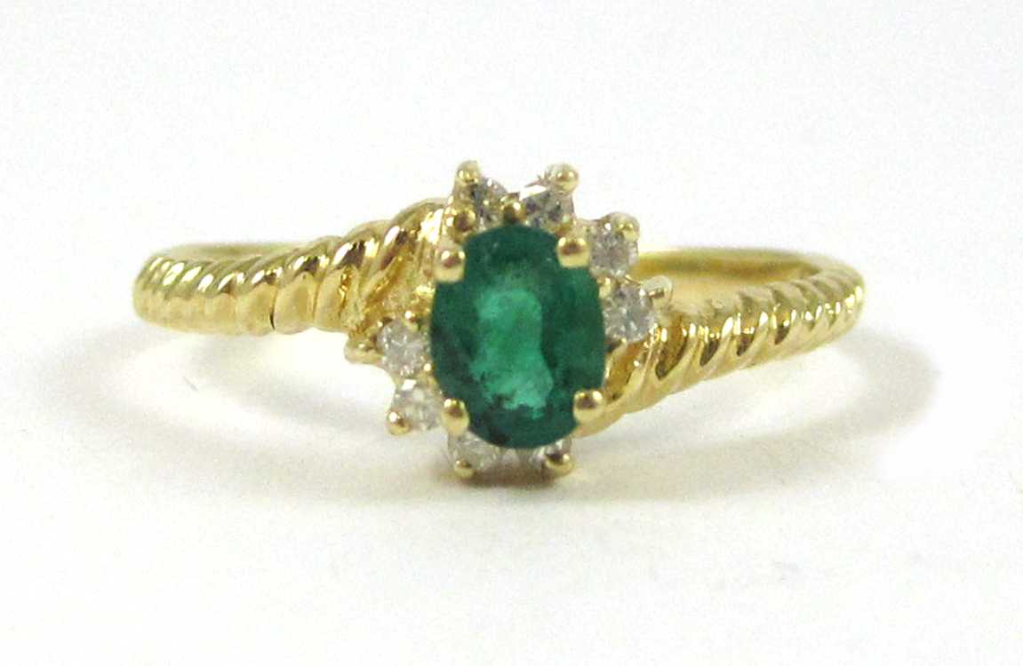 Appraisal: EMERALD DIAMOND AND FOURTEEN KARAT GOLD RING with eight round-cut