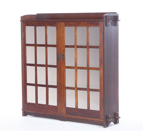 Appraisal: GUSTAV STICKLEY Two-door bookcase with twelve panes per door three