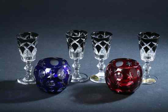 Appraisal: TWO FABERG CRYSTAL VOTIVES In red and cobalt Together with