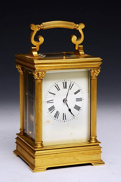 Appraisal: A FRENCH BRASS CARRIAGE CLOCK with pull repeat and presentation