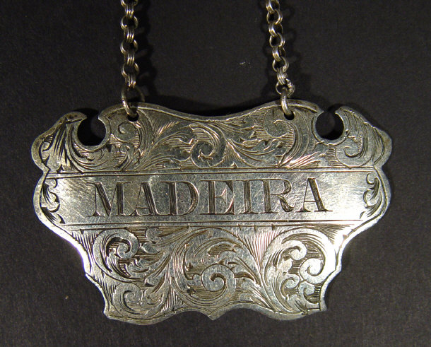 Appraisal: Victorian silver decanter label engraved 'Madeira' and chased with leaves