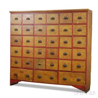 Appraisal: Large Yellow- and Red-painted Thirty-three-drawer Chest th century ht wd