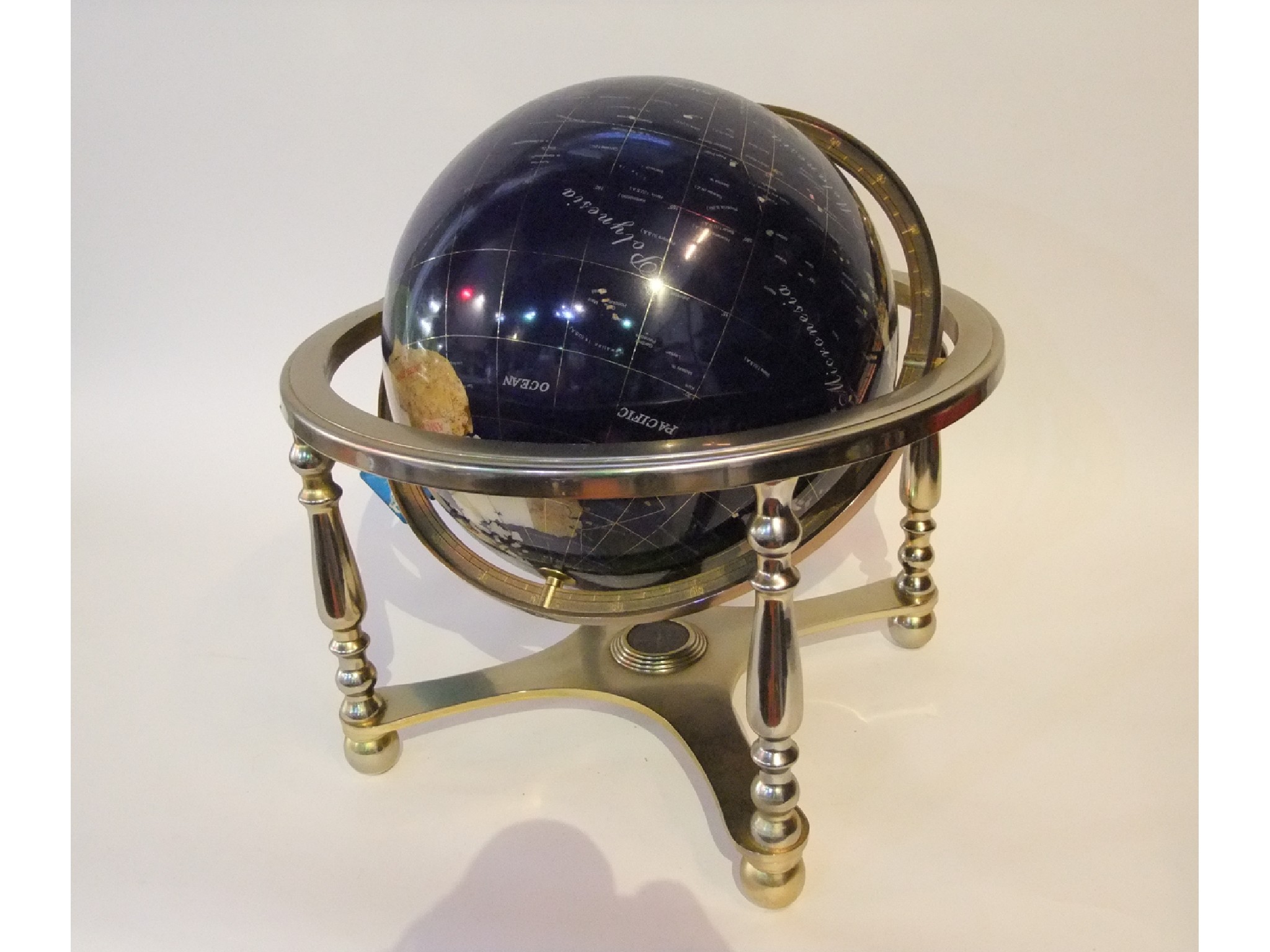 Appraisal: A large globe comprised of cut and polished semi-precious stone