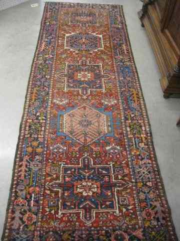 Appraisal: Heriz Persian Handmade Runner geometric medallions surrounded by stylized florals