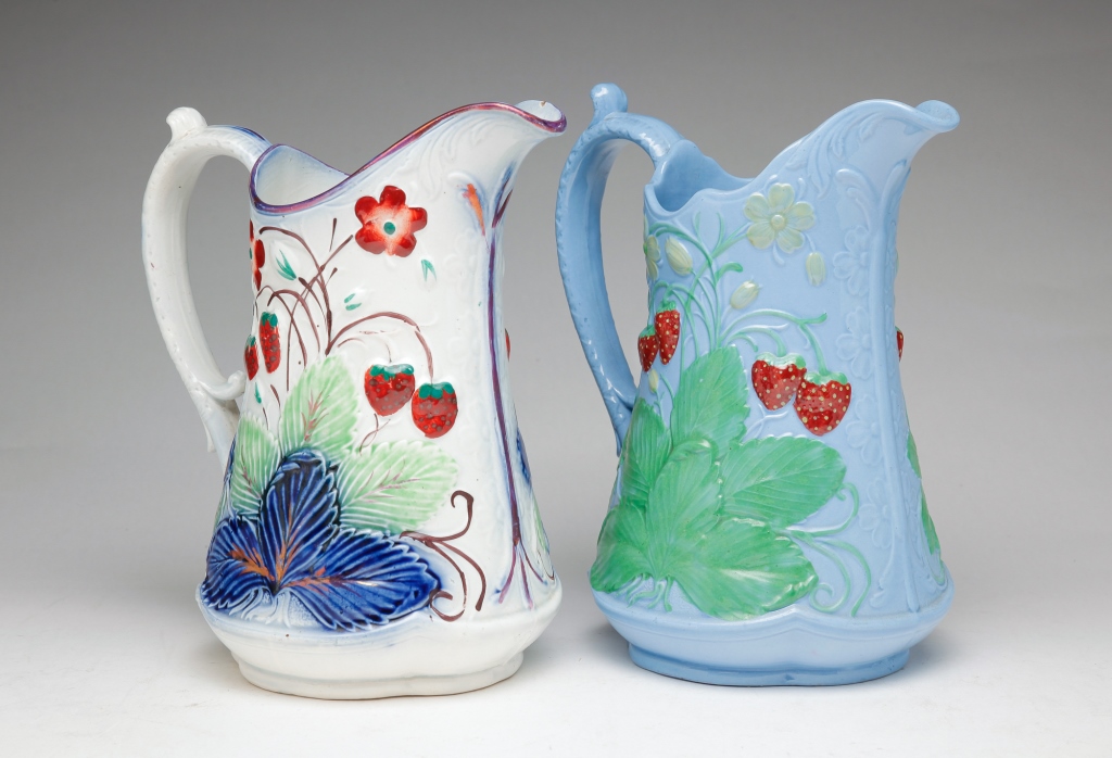 Appraisal: TWO ENGLISH STRAWBERRY PITCHERS Mid- th century Earthenware pitchers Blue