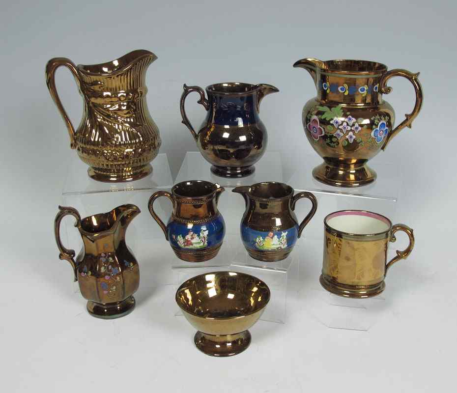 Appraisal: STAFFORDSHIRE COPPER LUSTER piece collection to include pitchers and jugs