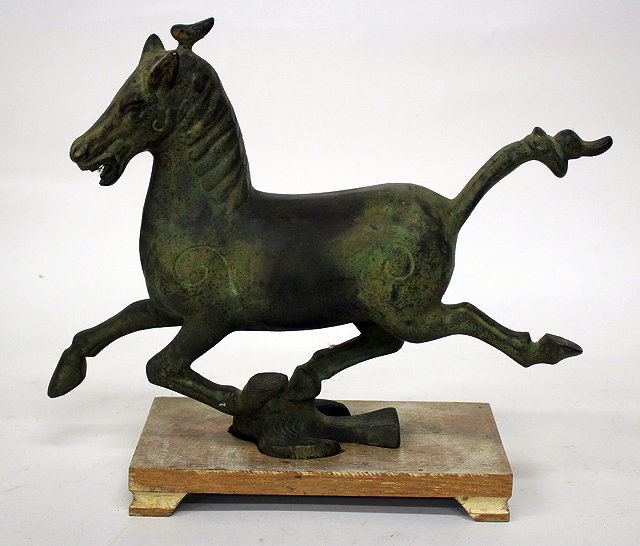 Appraisal: A BRONZE SCULPTURE OF A RUNNING HORSE after the Chinese