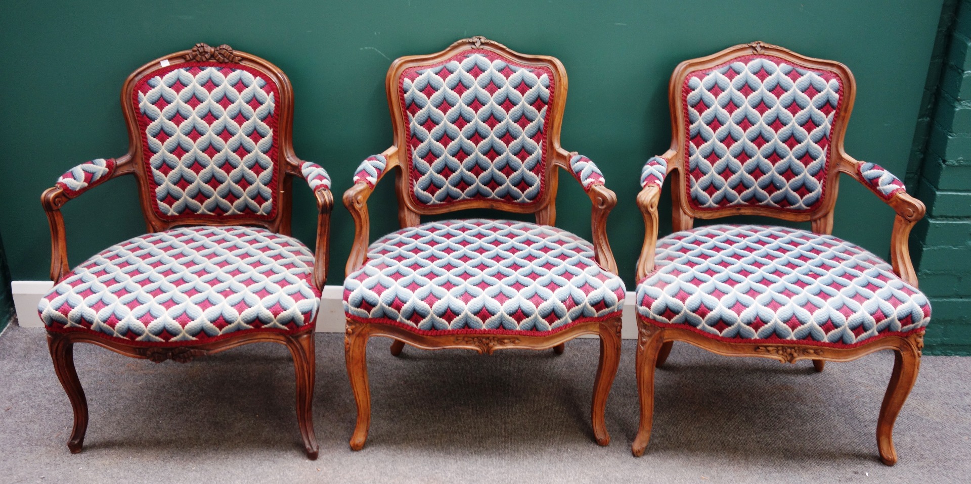 Appraisal: A matched set of three walnut framed Louis XV open