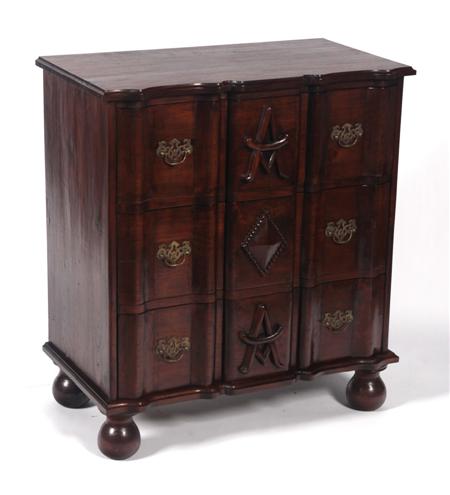 Appraisal: A th century mahogany serpentine chest the moulded top over