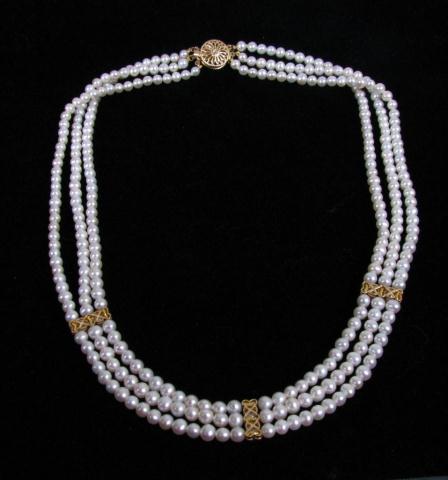 Appraisal: K Yellow gold triple strand pearl necklace with diamond accents