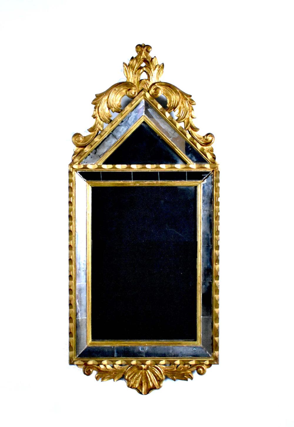 Appraisal: ITALIAN BAROQUE STYLE GILTWOOD MIRRORThe mirror-framed-mirror with a pointed arched