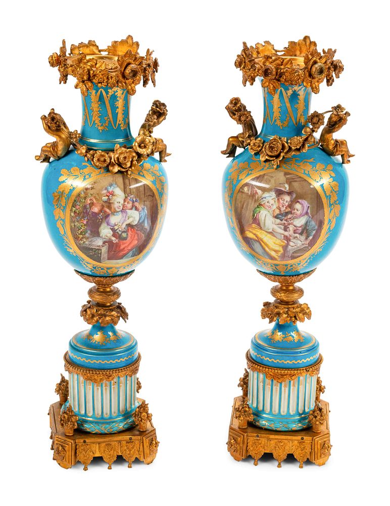 Appraisal: A Pair of Sevres Style Gilt Bronze Mounted Porcelain Urns