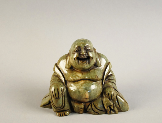 Appraisal: A Carved Jade Hotei or seated laughing Buddha high