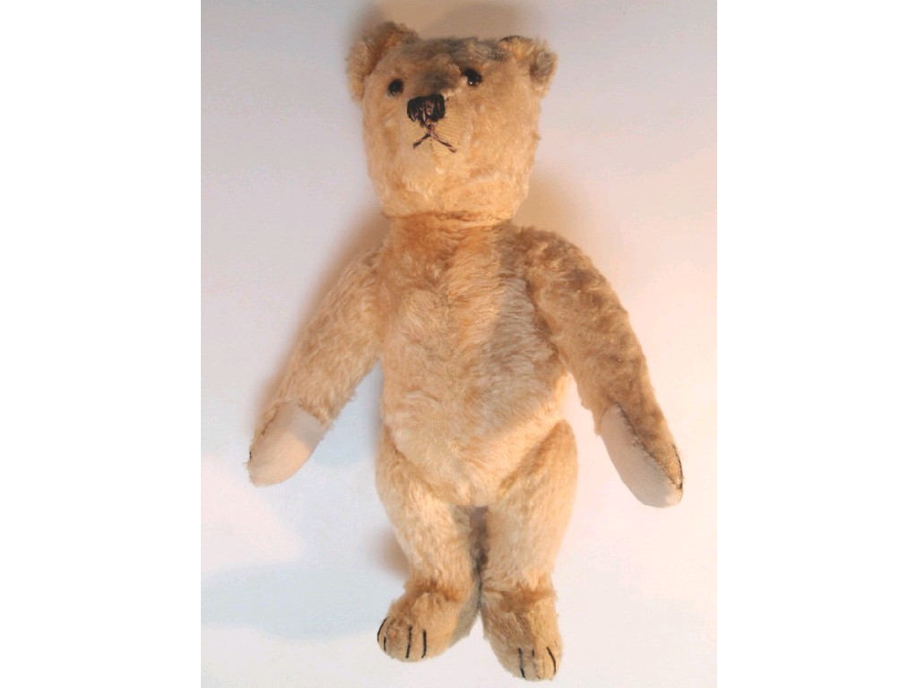 Appraisal: A golden plush jointed teddy bear cm high