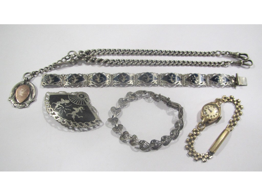 Appraisal: Lot comprising Siamese silver plaque bracelet and fan shaped brooch