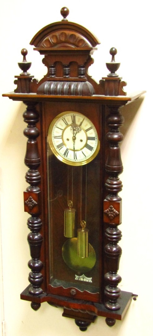 Appraisal: A late thC walnut cased Vienna wall clock by Gustav