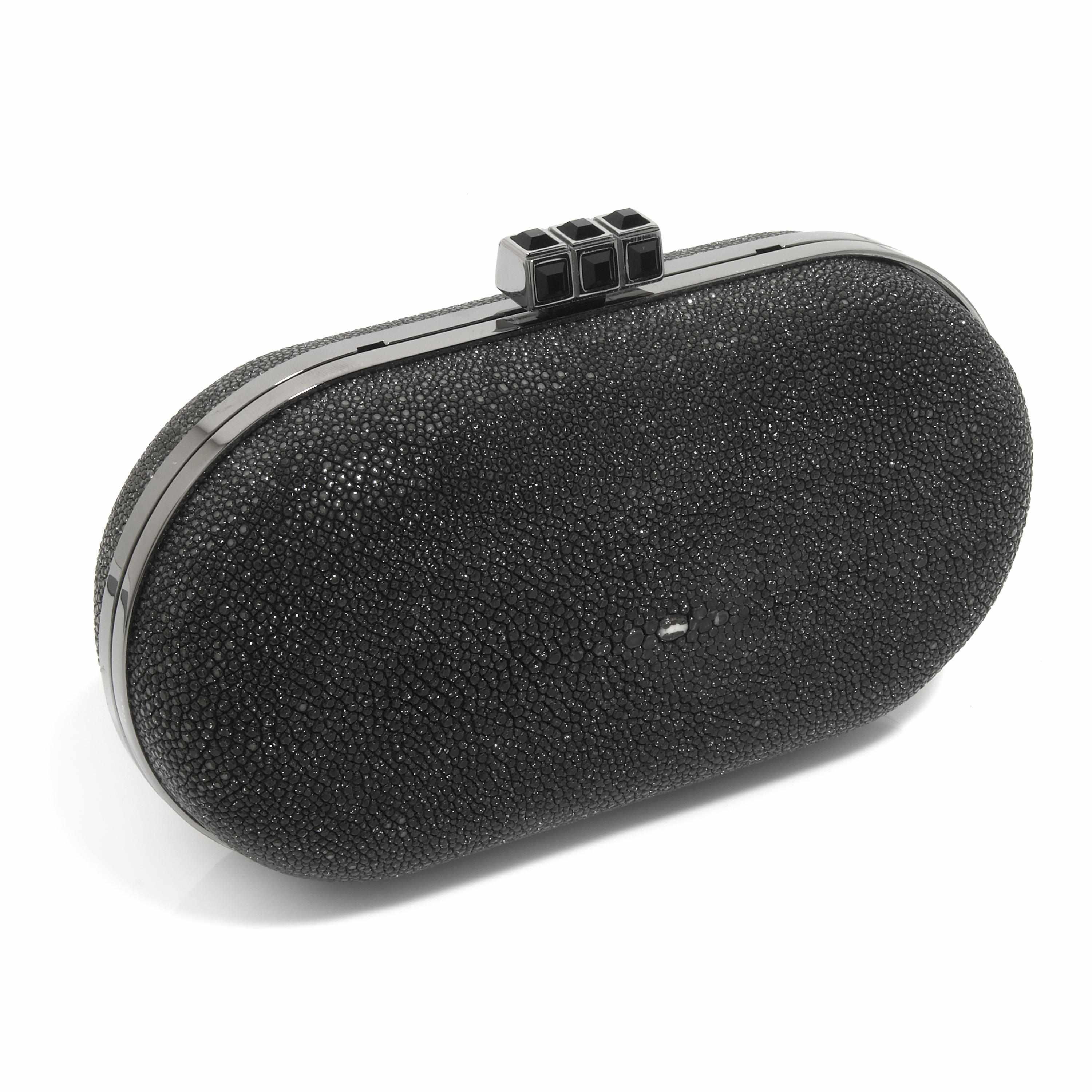 Appraisal: An oval-shaped black shagreen purse with a black rhinestone closure