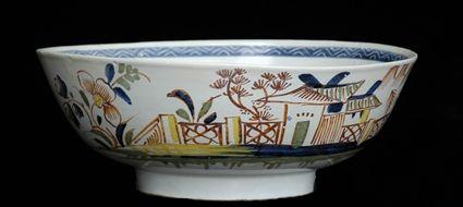 Appraisal: LIVERPOOL-TYPE POLYCHROME BOWL The interior with flower and s-scrolls saw-tooth