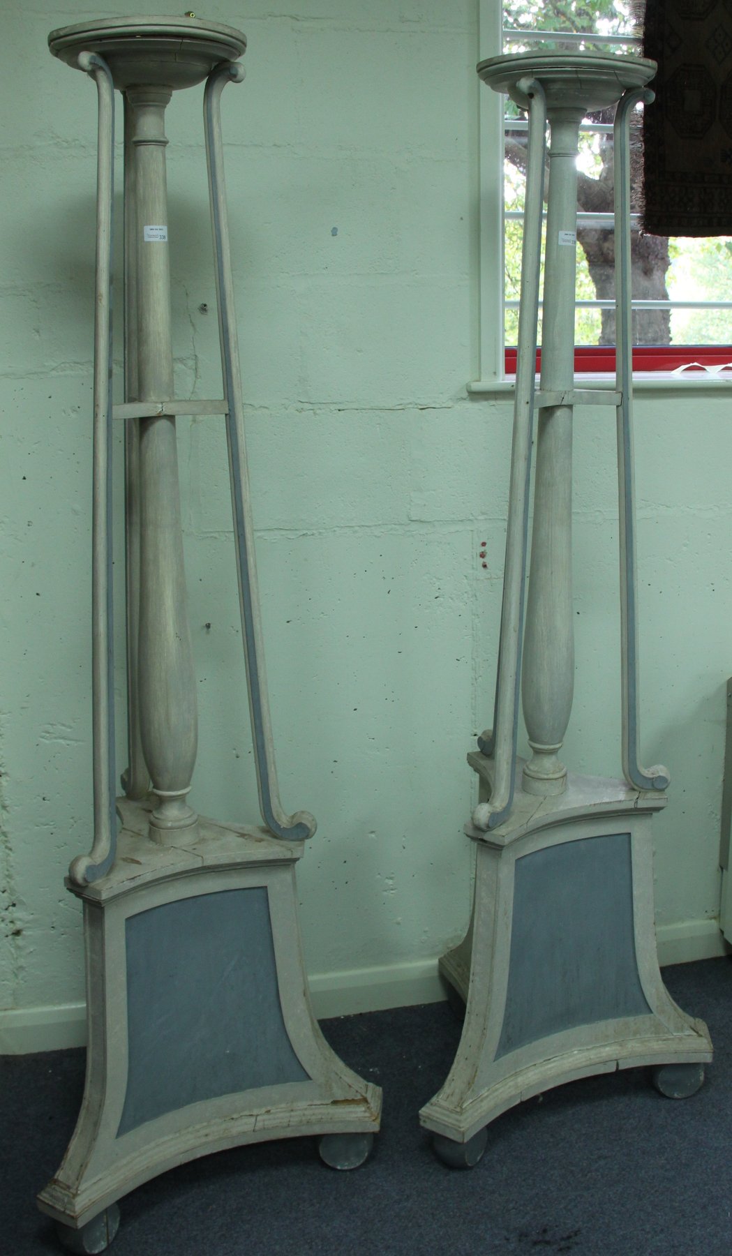 Appraisal: A pair of Robert Adam style torch res with circular