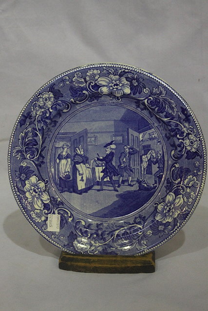 Appraisal: A BLUE TRANSFER POTTERY PLATE Dr Syntax disputing his bill