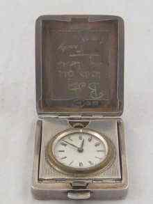 Appraisal: A small silver travelling clock hallmarked for London and measuring