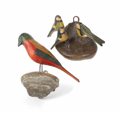 Appraisal: Two Pennsylvania carved and painted bird figures ca mounted on