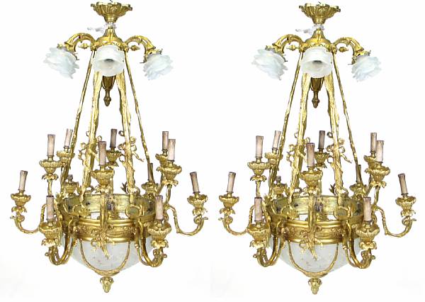 Appraisal: A pair of Neoclassical style gilt bronze twelve light chandeliers