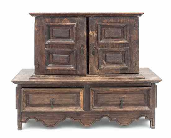 Appraisal: An Oak Jewelry Box the rectangular top over two paneled