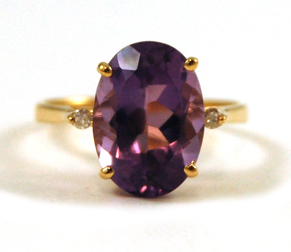 Appraisal: AMETHYST DIAMOND AND FOURTEEN KARAT GOLD RING set with two