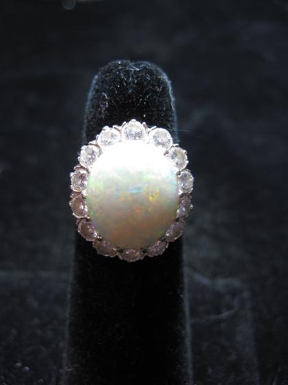 Appraisal: karat yellow gold opal and diamond dinner ringWhite opal prong