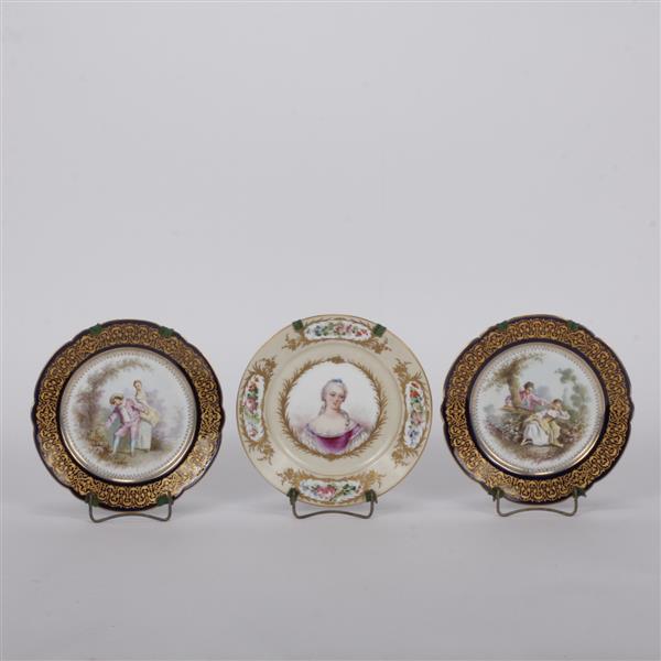 Appraisal: Three Sevres Chateau des Tuileries hand-painted and gilt cabinet plates