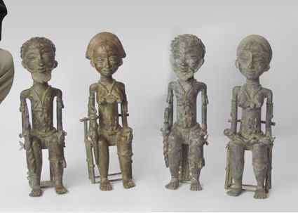 Appraisal: TWO SETS OF AFRICAN BRONZE CHIEF AND QUEEN IN THEIR