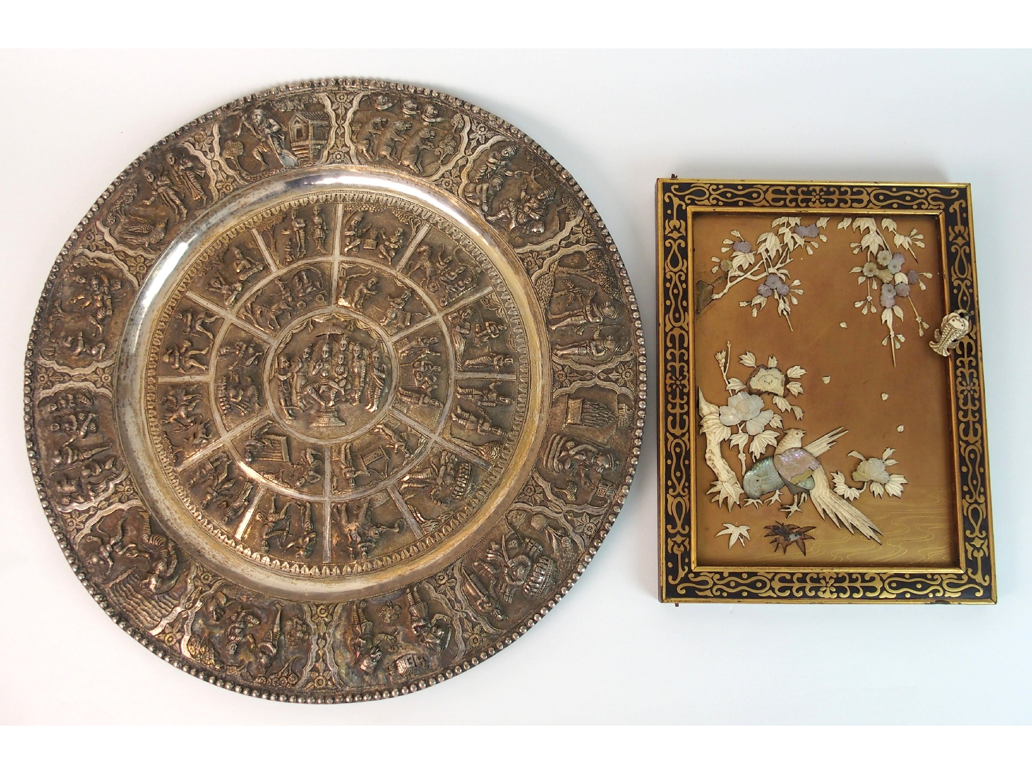 Appraisal: A Burmese electroplated circular salverembossed with numerous figures and animals