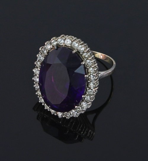 Appraisal: An amethyst and diamond cocktail ring the large central oval