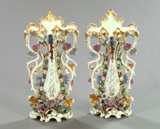 Appraisal: Pair of Franco-Bohemian Exuberantly Modeled Porcelain Garniture Vases in the