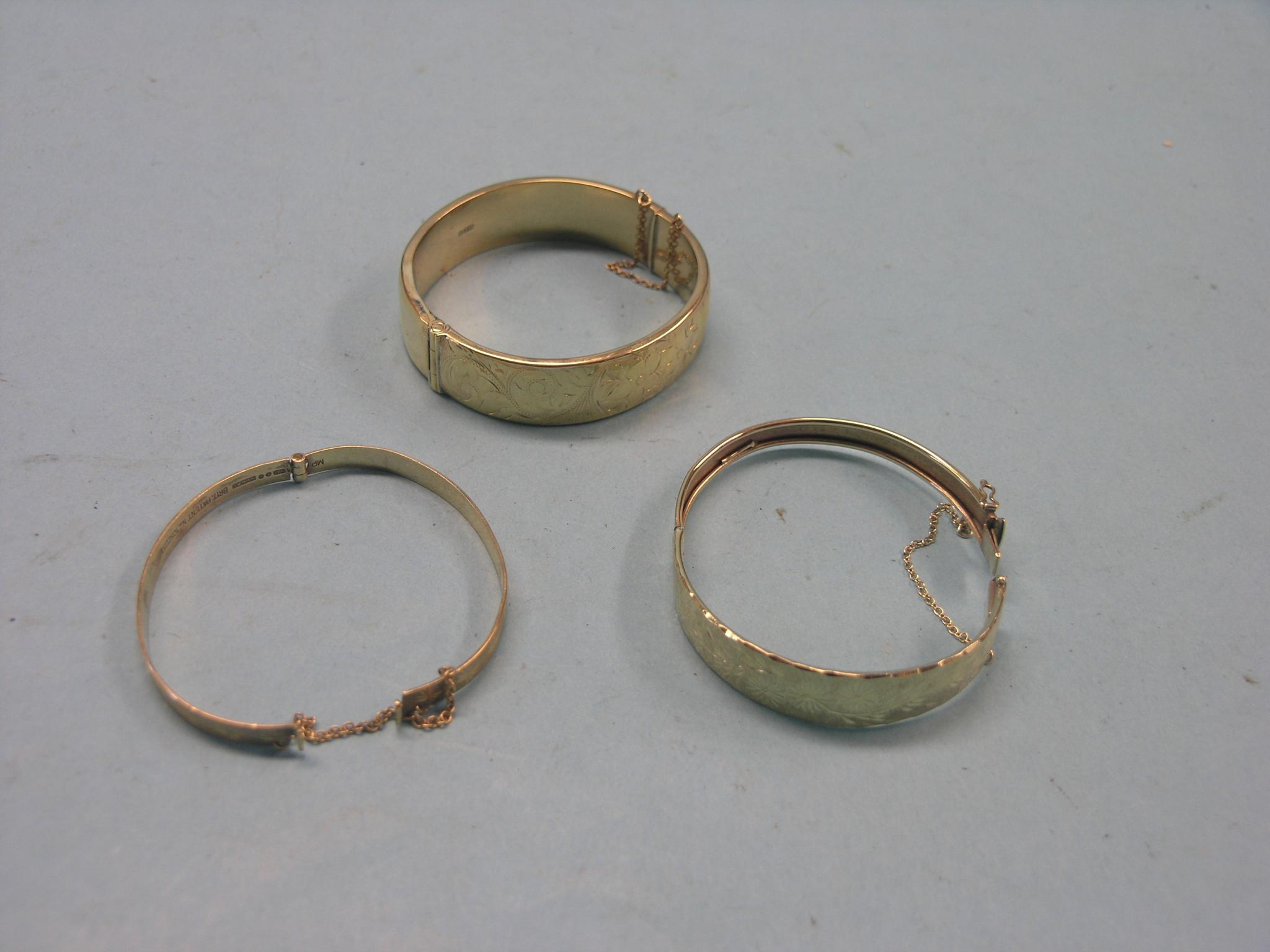 Appraisal: Three various ct gold bangles each with engraved ornament grams